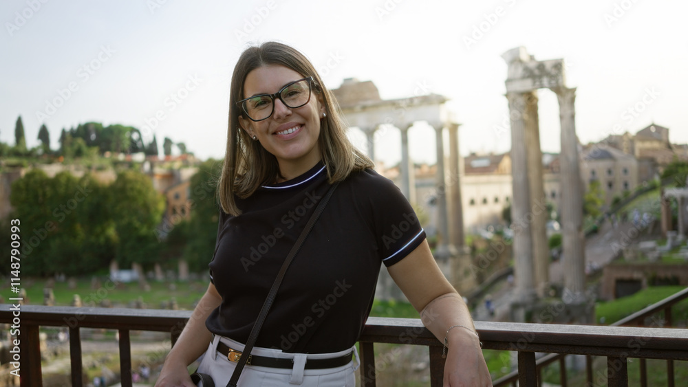 Wall mural Woman smiling at the roman forum in rome, italy, showcasing historic ruins with a young hispanic traveler enjoying the european landscape under sunny skies.