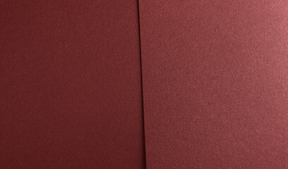 Burgundy red metallic paper texture with a satin shimmer and subtle grainy finish. The warm red-brown tones and smooth, refined surface exude sophistication, making it ideal for
