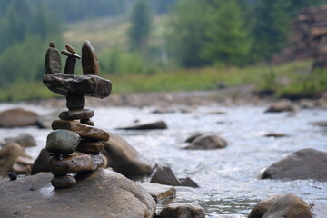 Unusual figurine made of river pebbles.