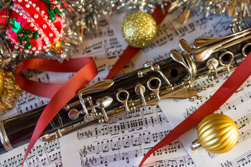 a clarinet with a christmas tree backgound