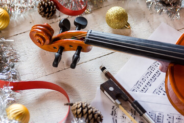 a violin wiht a christmas tree