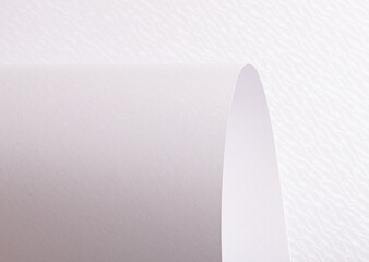 White paper texture with a pearlescent shimmer and soft curved patterns. The luminous, refined...