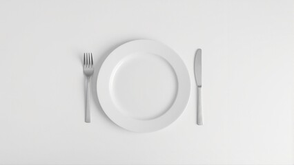 Minimalist dining table setting with symmetrical fork and knife on a white plate