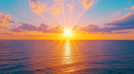 Fototapeta premium Stunning Sunset Over Tranquil Ocean with Vibrant Colors and Radiant Sun Rays Displaying Peaceful Evening Atmosphere and Natural Beauty