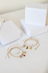 White box mockup colorful necklaces on white background