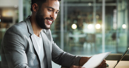 Laptop, auditor and businessman reading paperwork for profit report, bookkeeping or revenue at night. Computer, document and happy accountant check information, finance results or savings on overtime