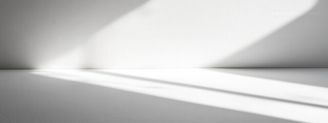 Minimalist white background with soft shadows and a clean surface, perfect for product photography