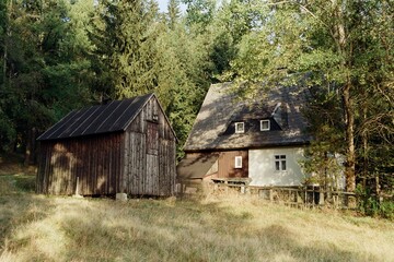 cottages german Ore mountains near Kuhnhaide  in Czechia on 23. September 2024 on color film - blurriness and noise of scanned 35mm film were intentionally left in image