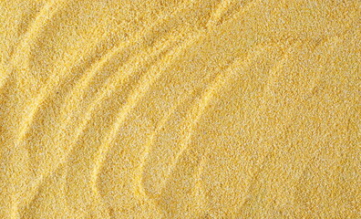 Corn polenta uncooked background and texture, top view 