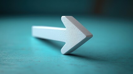White arrow pointing left on teal background.