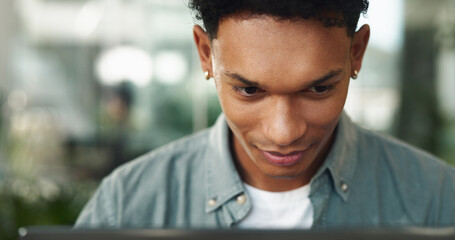 Man, reading and computer in office for business, creativity and smile for positive feedback....