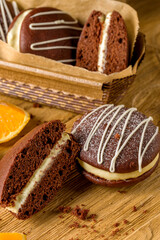 Whoopie pie with orange cream. Delicious homemade dessert.