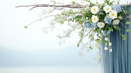   A white-blue floral arrangement on a blue backdrop with a twig protruding from top