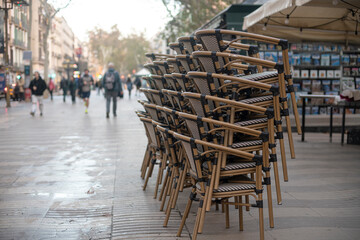 Chairs prepared before opening restaurant on Rambla, Barcelona, Spain.