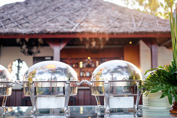 Outdoor Event Catering with Stainless Steel Buffet Warmers in Tropical Setting