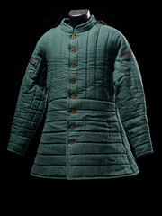 Historical fashion. Medieval knight cloth. Padded jacket gambeson.
