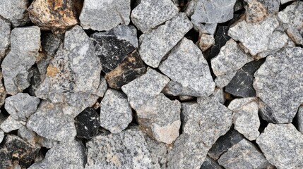 Fototapeta premium Grey and Black Irregular Shaped Stones Wall