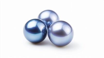 Realistic arrangement of a few natural blue pearls with a soft, silvery-blue sheen and smooth surface on a white background