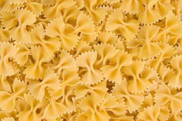 close up of a uncooked italian farfalle pasta background