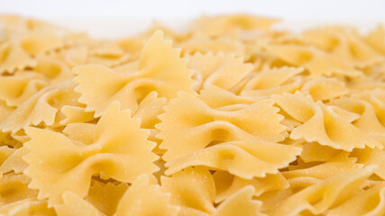 close up of uncooked farfalle pasta, selective focus