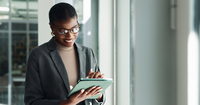 Tablet, typing and smile with business black woman in office for creative director, branding designer and search. Communication, email and digital with employee in startup agency for website and app - Powered by Adobe