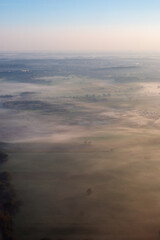 Fog in the morning over typical german Autobahn landscape Sunset from an Air Plane
