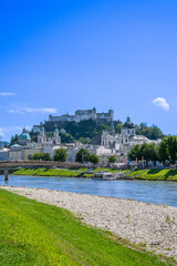 Fototapeta premium The City of Salzburg with Salzach River and Fortress Hochensalzburg in the State of Salzburg in Austria.