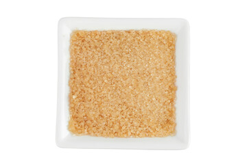 The brown sugar in ceramic bowl isolated on white background. Top view. Flat lay