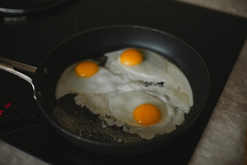 Fresh eggs sizzling in the pan — a delicious start to the day, filled with aroma and energy