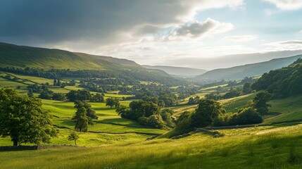 Obraz premium Serene Green Valley Landscape Under Dramatic Sky in Nature Scene