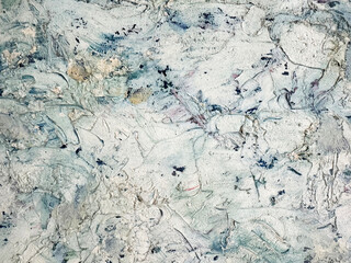 Abstract textured surface with muted colors and organic patterns
