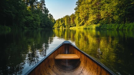 Obraz premium Serene River Canoe Ride Through Lush Forest