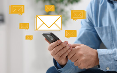 Man using mobile phone indoors, closeup. New message notification near device. Illustration of...