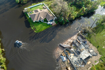 Flooded houses by hurricane rainfall in Florida residential area. Consequences of natural disaster