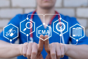 Doctor working on virtual touch screen presses abbreviation: EMA. Concept of EMA European Medicines...