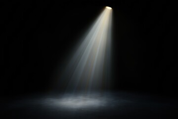 A dark room with a spotlight shining on a spot on the floor. The light is bright and creates a dramatic effect