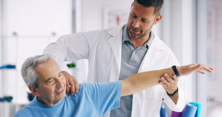 Senior person, stretching arm and man in physiotherapy for help, recovery or exercise for healing. Elderly patient, chiropractor or exam in practice for muscle care, strengthen shoulder or healthcare