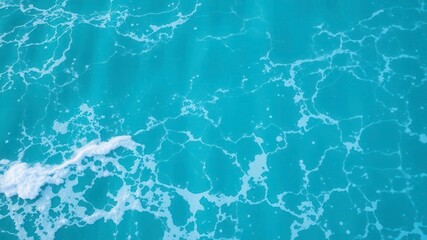 Pure blue turquoise water with gentle foam and rolling waves, serene ocean backdrop for design projects, travel brochures, relaxation, ocean, design, serene