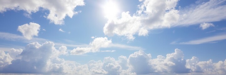 Obraz premium White fluffy clouds floating in a clear blue summer sky, creating a serene and beautiful landscape, clouds, horizon