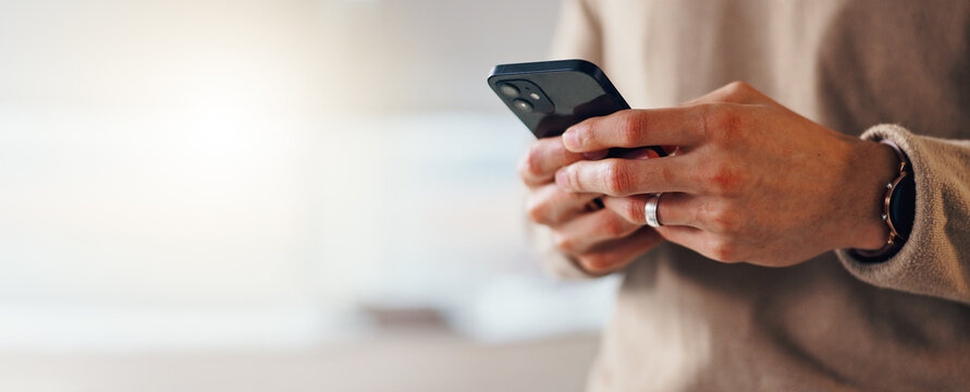 Banner, hands and businessman in office with smartphone for texting on social media, mockup and website. Break, space and consultant with mobile in workplace for message, technology closeup or app
