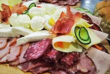 Cold appetizer. Cold smoked meat plate with prosciutto, salami, bacon, pork chops and cheese