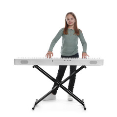 Cute girl playing synthesizer on white background