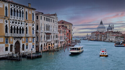 view from the Accademia Bridge Grand Canal Basilica of Santa Maria della Salute Venice Italy canals St. Mark's Square sunset vaporetto