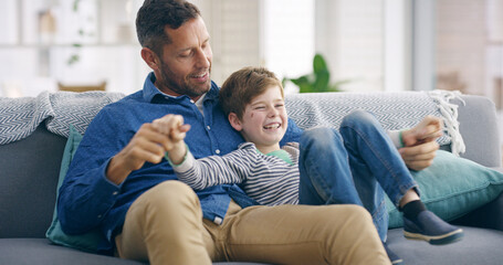 Playful, father and child on sofa for laughing, connection and bonding together with funny conversation. Happy people, dad and boy at home for relax, healthy relationship or parenthood in living room