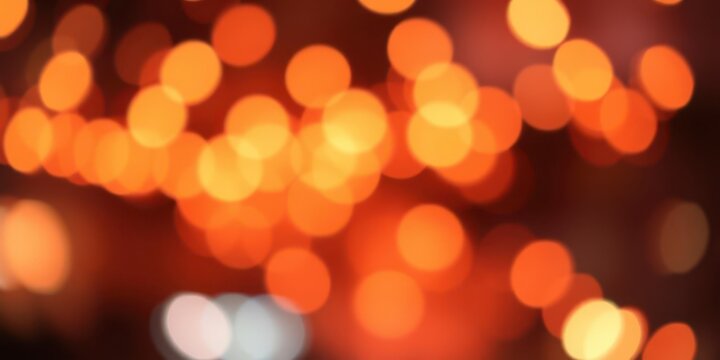 Abstract orange bokeh background with vibrant and soft blurred lights creating a warm and energetic atmosphere, lights, orange, soft