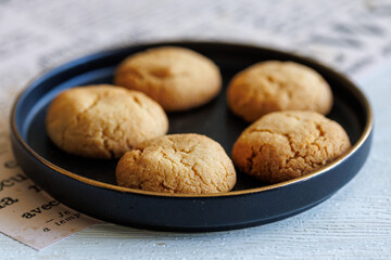 Quick Easy Vegan Tahini Cookies on black plate close up