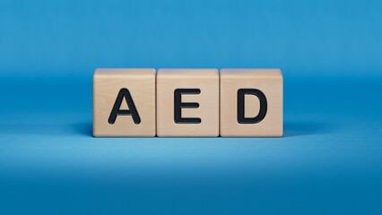 wooden cube block with aed business word.close up of wooden elements,Business Concept.3D rendering on blue background.