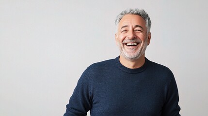 Mature Man Laughing Heartily in Studio Portrait Setting