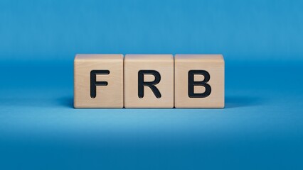 Business man hand holding wooden cube with frb text. Financial, marketing.close up of wooden elements,Business Concept.3D rendering on blue background.