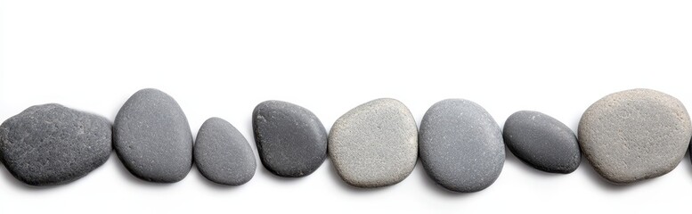 A minimalist arrangement of smooth, gray pebbles lined up in a row against a white background, showcasing their unique shapes and textures.